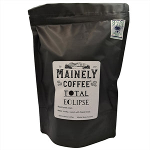 A black bag of coffee with a label saying, "Total Eclipse" with a Maine Made sticker