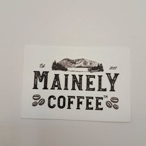 A white sticker with the Mainely Coffee logo in black